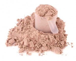 Whey protein powder in scoop isolated on white